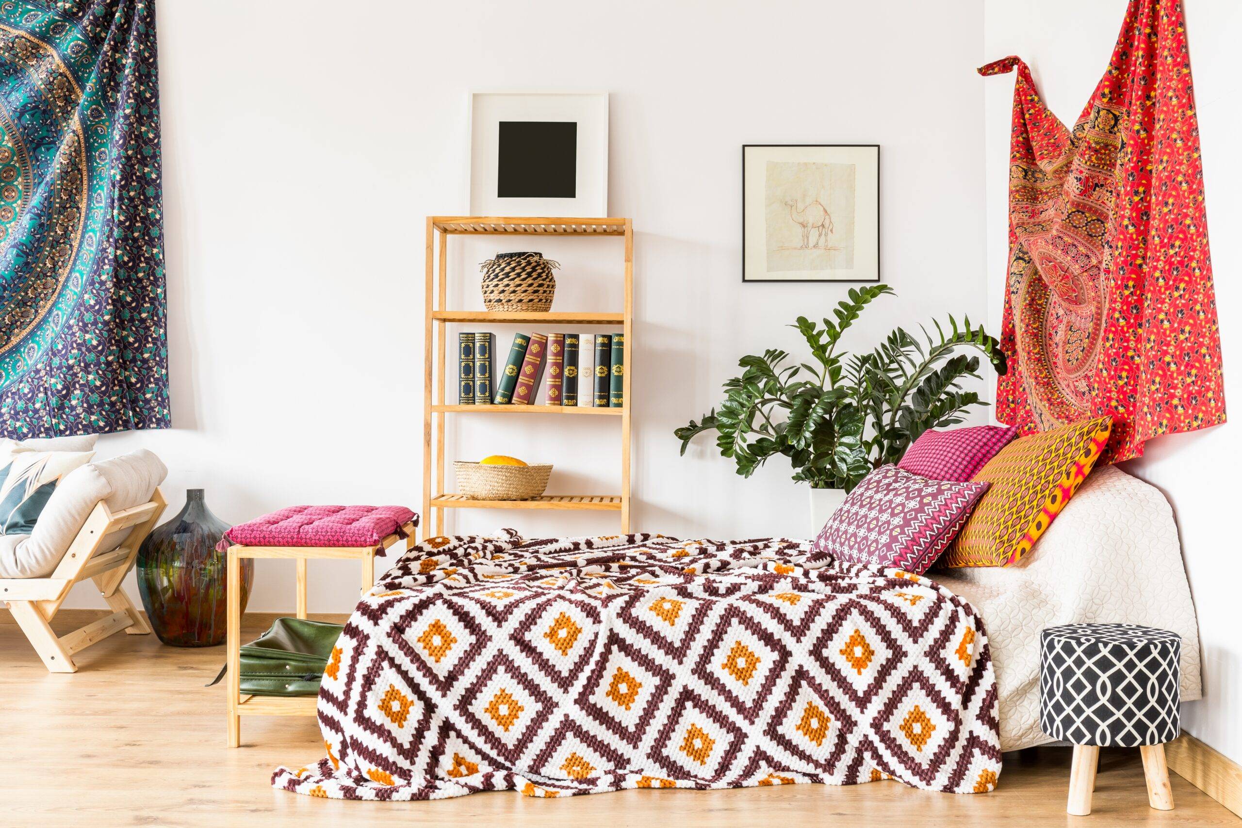 King-size bed with colorful pillows in bedroom