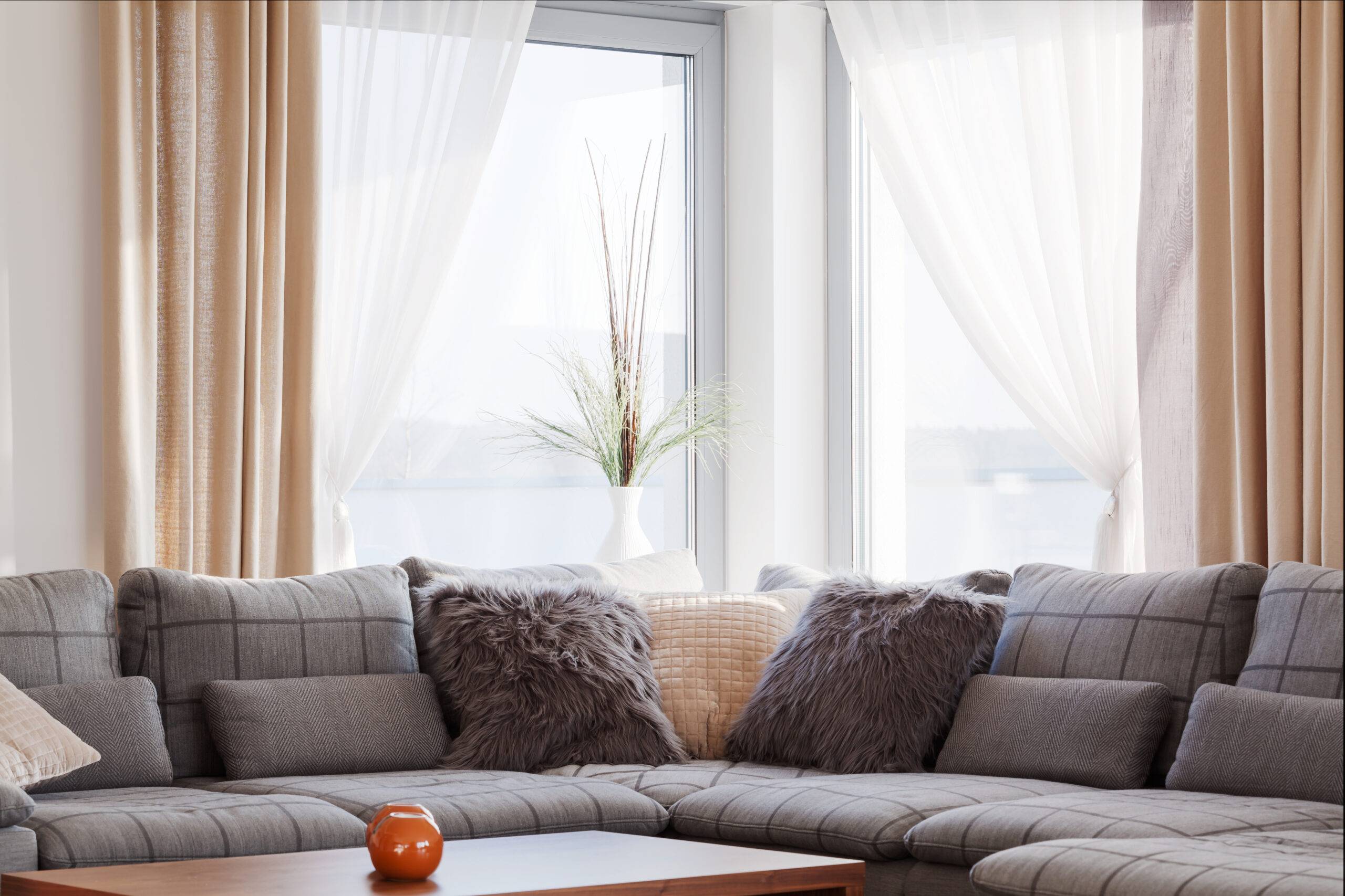 Big comofrtable sofa in bright contemporary lounge