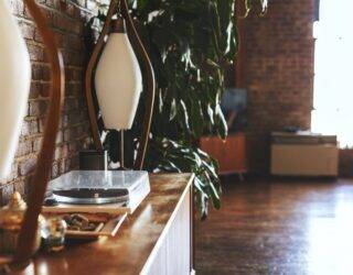 A mid-century modern sideboard with a record player.